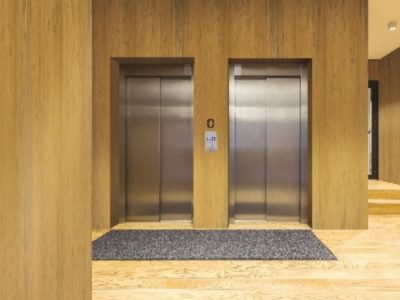 Teak wood veneer wall panels in a luxury hotel lobby by Mikasa Decowood Veneers